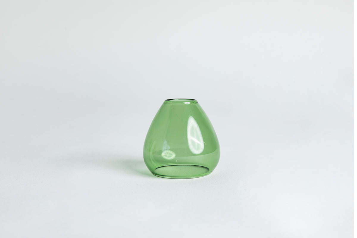 Dome-shaped green clear glass. set on a white background with