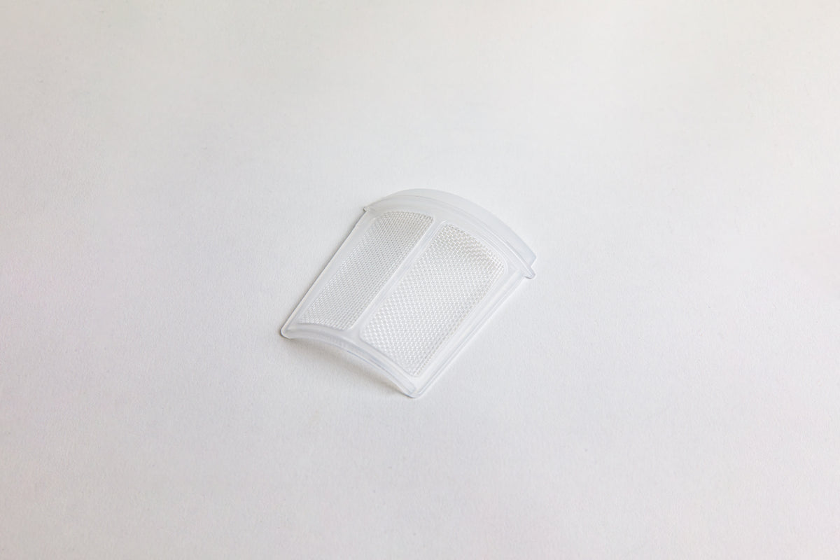 White mesh filter. set on a light gray background