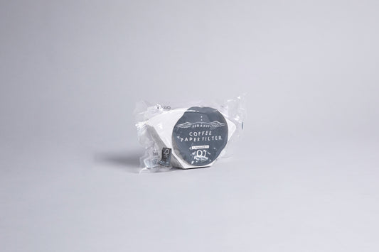 White flat bottom cone shaped paper filters in plastic bag with gray and white accents label. set against a light gray background.