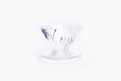 clear plastic cone dripper on white background.