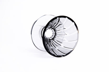 clear gray plastic cone dripper showing interior ribbing on white background.