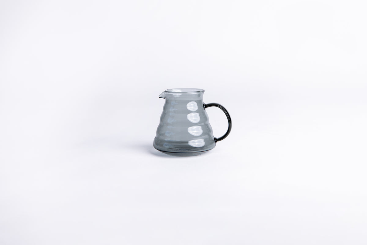 clear gray beehive pitcher on white background