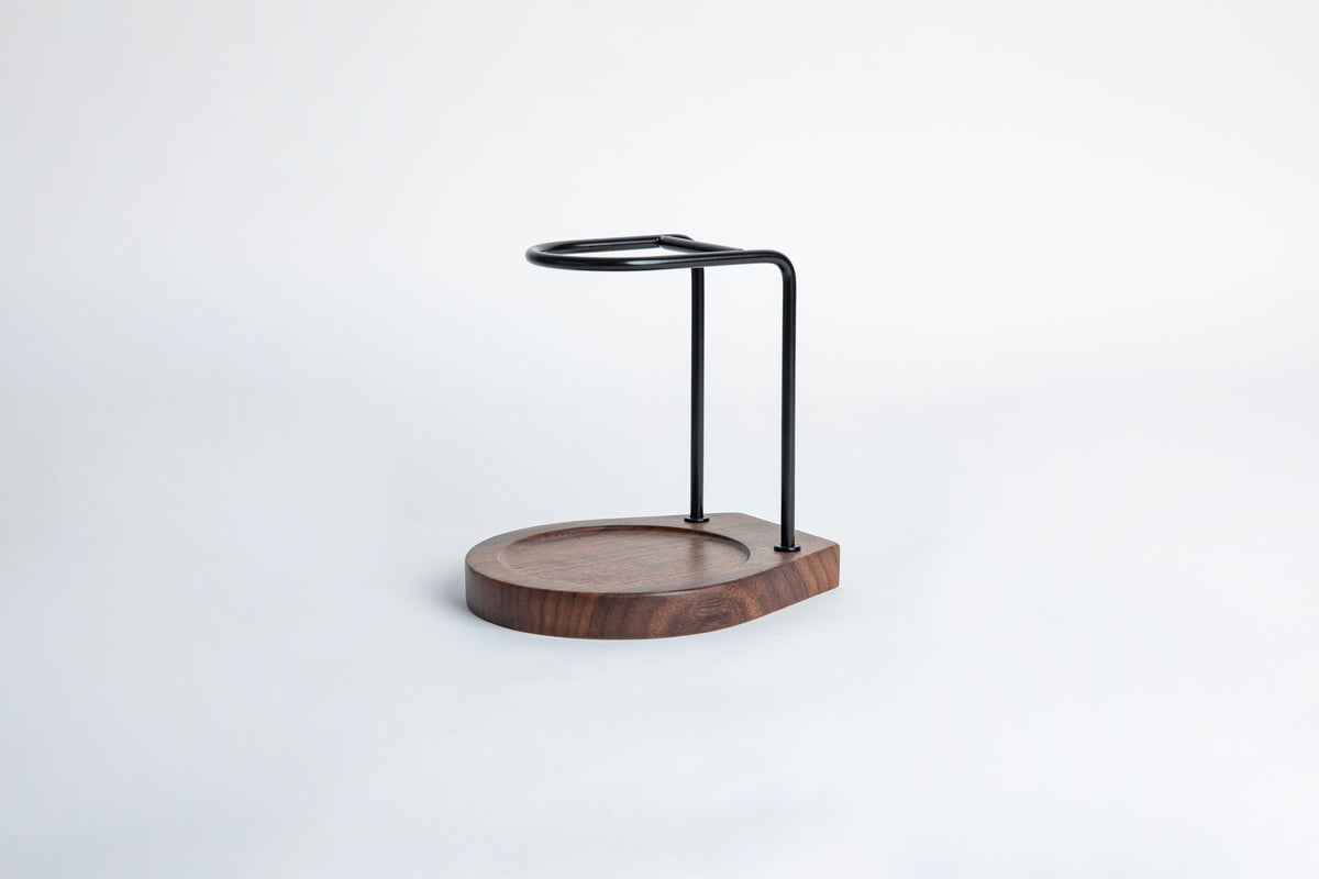 Wooden stand with metal holder on a white background