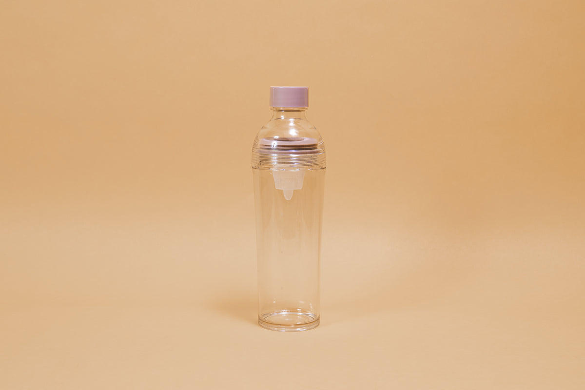 Clear plastic bottle with removable nylon tea strainer and pink plastic cap.